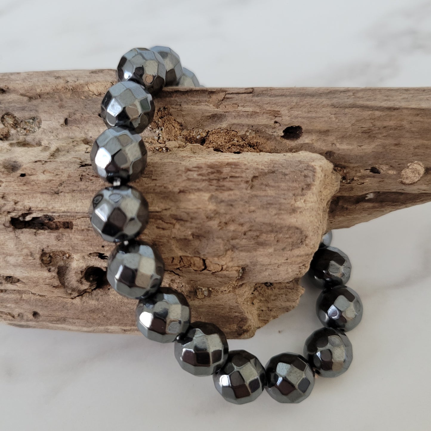 MENS 10MM FACETED HEMATITE