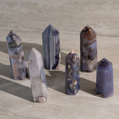 Set of six crystal points on a beige surface