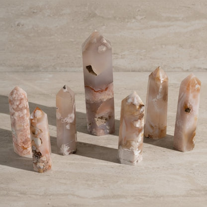 Set of crystal points on a light wooden surface
