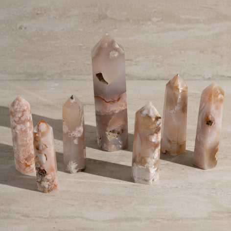 Set of crystal points on a light wooden surface