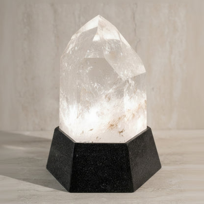 Crystal lamp with black base on a neutral background