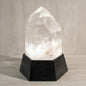 Crystal lamp with black base on a neutral background